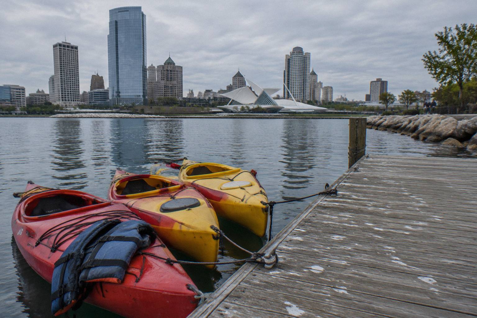 Rental kayaks tied up at a dock on the Milwaukee River, Milwaukee