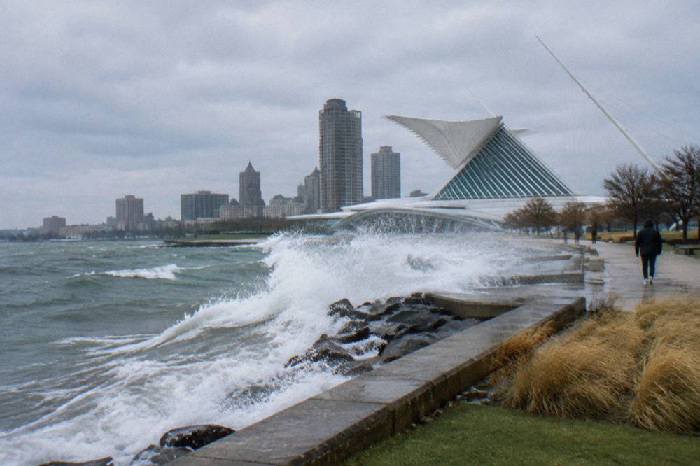 Waves breaking along the Milwaukee lakefront breakwater on a breezy day