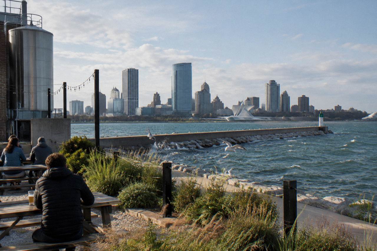 Milwaukee harbor breakwater with the downtown skyline across Lake Michigan water