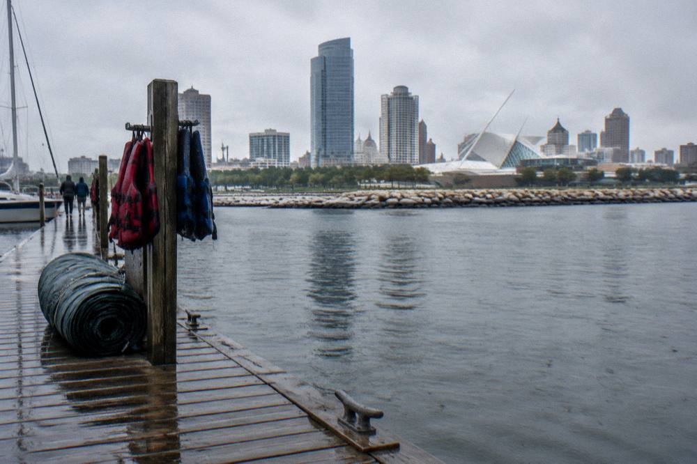 Calm lakefront harbor water beside a wooden dock at Discovery World
