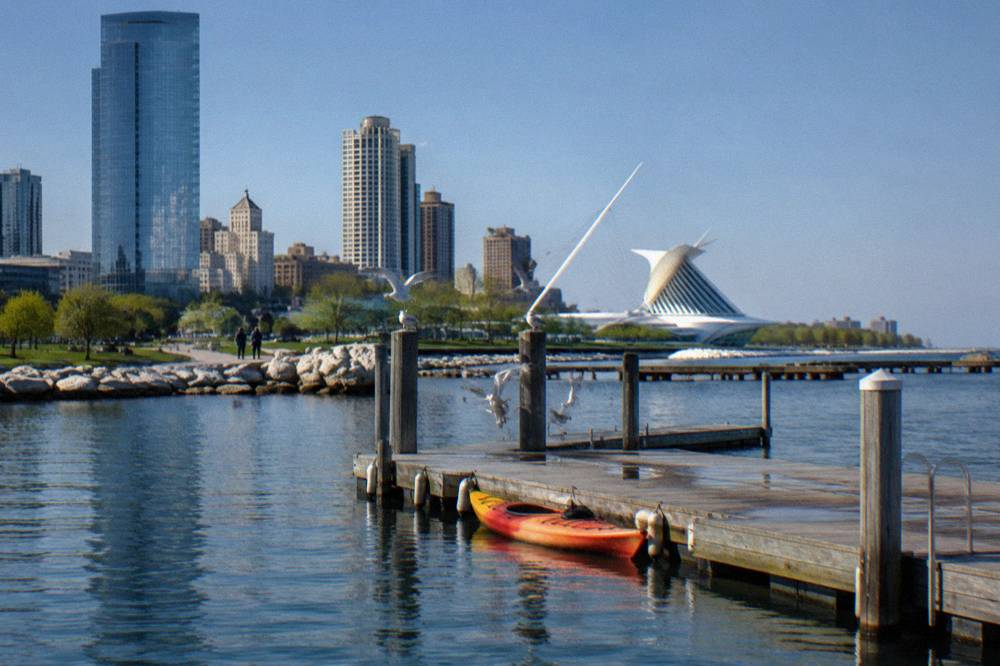 Calm harbor water beside a wooden dock on the Milwaukee lakefront on a sunny day
